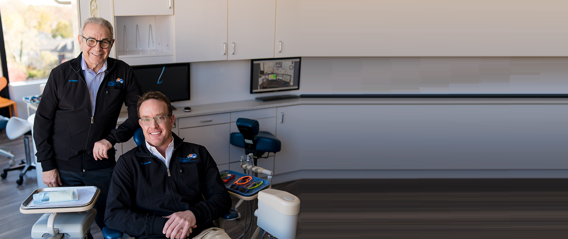 Dr. Charlie Coulter and Dr. Jerry Casper pose in the office of their pediatric dentistry practice in Washington, DC.